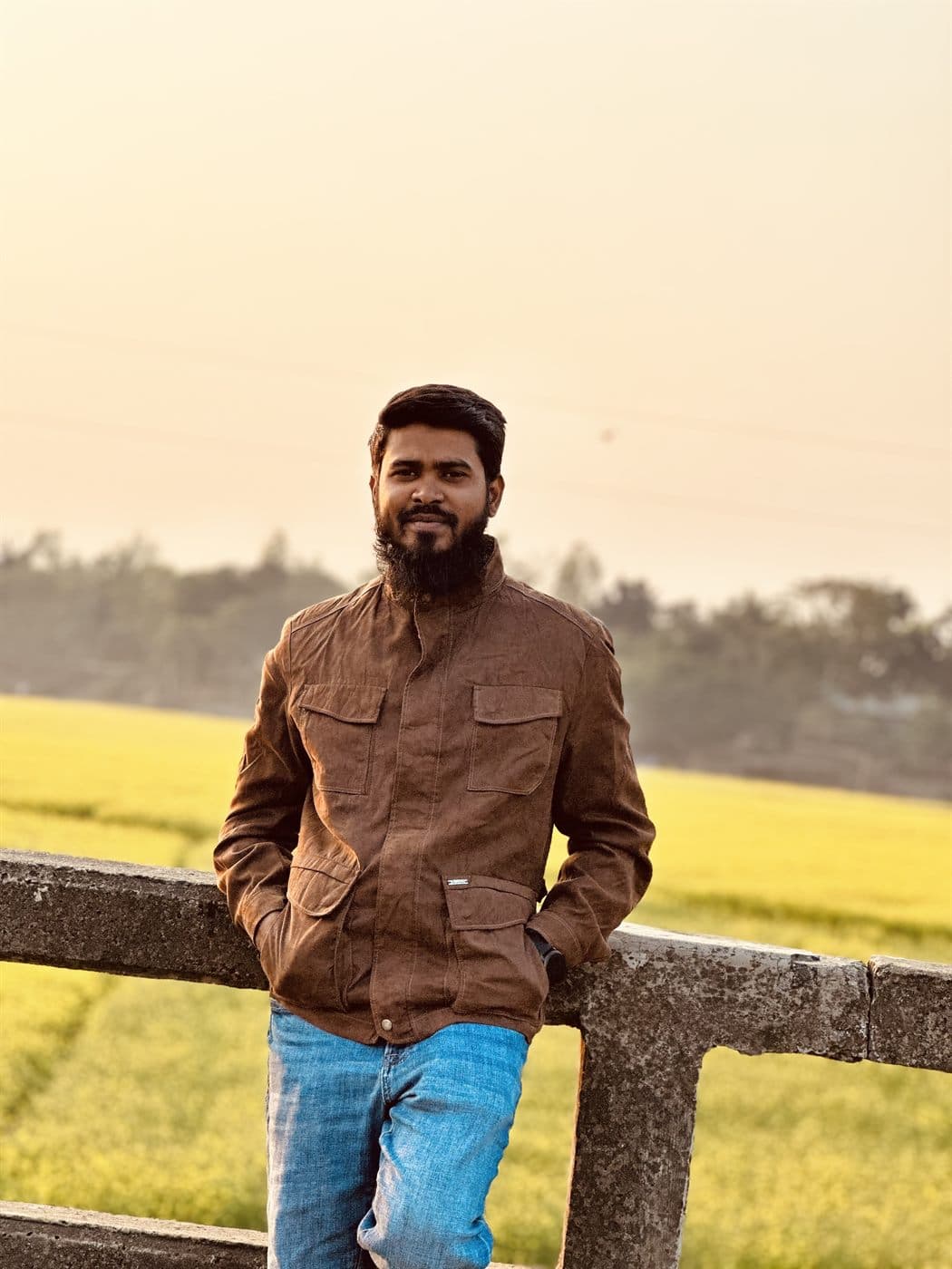 RH Razu at sunset beside a mustard field